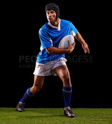 Buy stock photo Black background, man and rugby ball for winter sport or training for workout, fitness and skill for competition. Person or player on grass and athlete practice or active for football game or match.