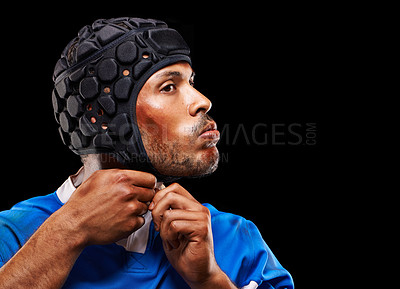Buy stock photo Rugby, dark studio background and man getting ready for training, competition and sportswear. Athlete, player and young male person with confidence for professional sport, workout or exercise