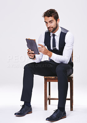 Buy stock photo Studio, portrait and man with chair, tablet and business for style and fashion. Professional, lawyer or attorney with corporate, technology and consultant with suit isolated on white background