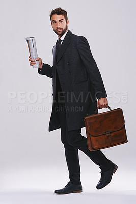 Buy stock photo Businessman, briefcase and career walking in studio for employee commute, white background or mockup space. Male person, newspaper and journalist reporter for international news, article or new job