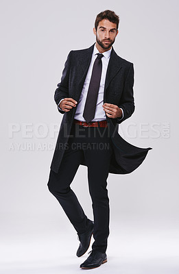 Buy stock photo Man, portrait and fashion with suit in studio with confidence, elegant style and black tie aesthetic. Suave model, person and face with attitude, stylish clothes and trendy coat on white background