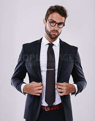 Buy stock photo Businessman, portrait and confidence in studio with professional suit for real estate job, sales or mockup space. Male person, face and glasses on white background for company, consultant or employee