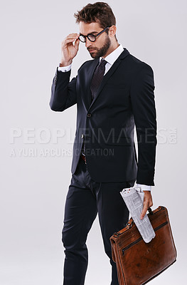 Buy stock photo Businessman, briefcase and professional career in studio as journalist with newspaper or international report, article or white background. Male person, glasses and mockup space, new job or employee
