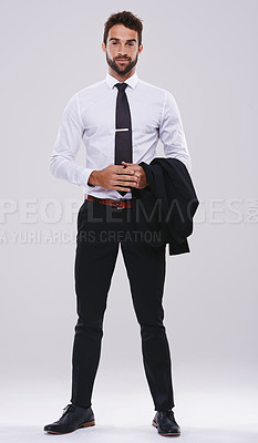 Buy stock photo Studio shot of a handsome and well-dressed young man