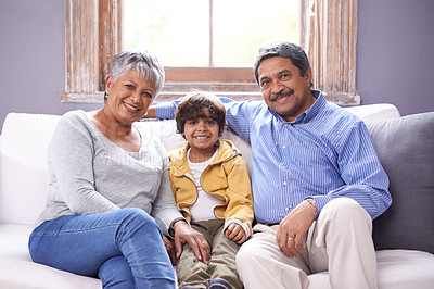 Buy stock photo Smile, sofa and portrait of grandparents with kid for bonding, support and care in living room. Relax, senior people and boy with happiness for childhood development, love and weekend at home