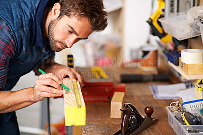 Buy stock photo Man, focus wood and tape measure for construction, home development and building renovation. Carpenter, maintenance employee and male repairman worker on a contractor job of builder working in house