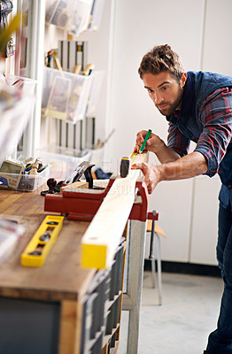 Buy stock photo Worker man, wood and tape measure for construction, home development and building renovation. Carpenter, maintenance employee and male repairman on a contractor job of builder working in house