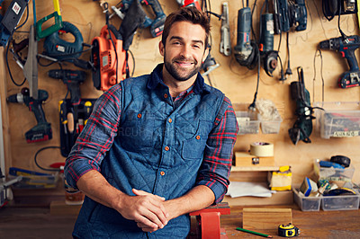 Buy stock photo Tools, carpenter and portrait of man in garage for home development, construction and renovation in workshop. Smile, male employee and contractor for maintenance, equipment and repair work for diy