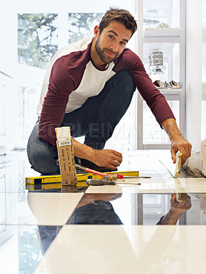 Buy stock photo Renovation, construction and portrait of man for remodel, home improvement and diy project. Tools, tiling and male employee with equipment for handyman, worker and maintenance service in house