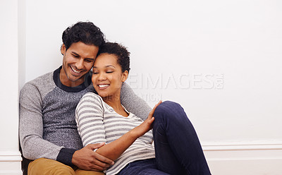 Buy stock photo Couple, floor and hug for care and love in home, smile and proud of marriage and commitment. People, affection and embrace in living room on weekend, support and trust or bonding in relationship