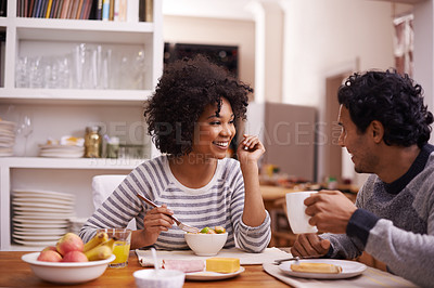 Buy stock photo Shot of a happy couple enjoying breakfast together
