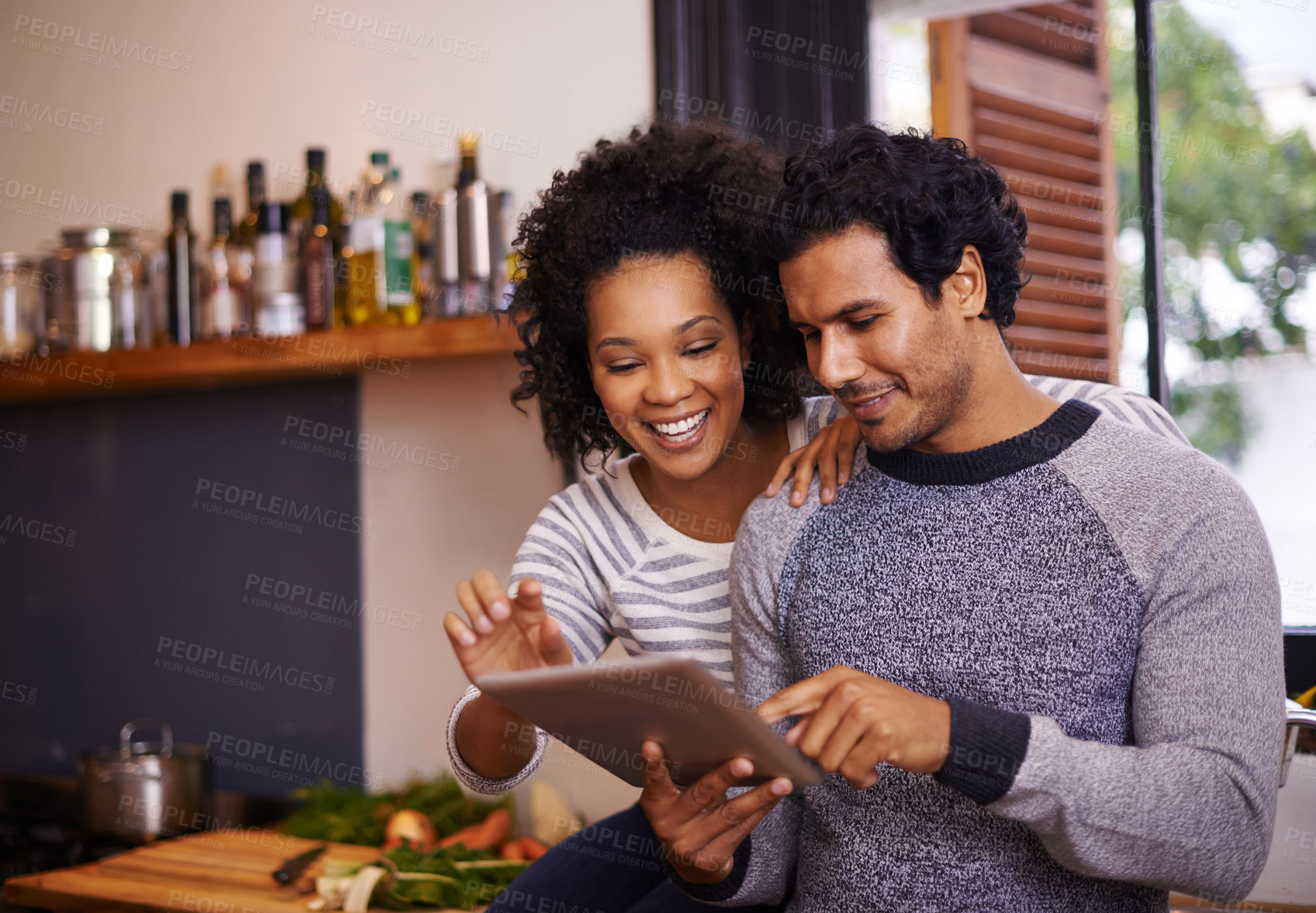 Buy stock photo Couple, tablet and cooking in kitchen with smile for online recipe, nutrition information and digital instructions. Man, woman and touchscreen in home for food website, bonding or happy for meal prep