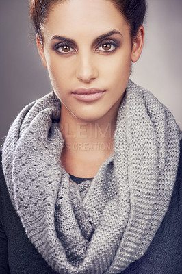 Buy stock photo Serious, scarf and portrait of woman for beauty, fashion and clothes with face isolated on gray background. Female person, gen z girl and student warm for cold weather, cool climate and wool garment