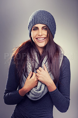 Buy stock photo Studio shot of a stylishly dressed young woman against a gray background