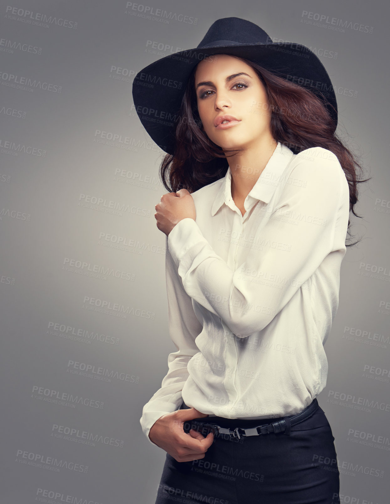 Buy stock photo Confident, style and portrait of woman in studio with classy, trendy and stylish hat for outfit. Clothes, fancy and young female person with elegant fashion and accessory isolated by gray background.