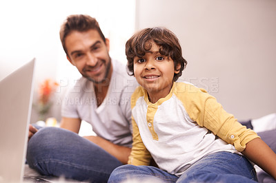 Buy stock photo Portrait, father and child with laptop in bed for connectivity, technology and streaming online for cartoon. Family, man and young boy at home with computer, movie and bonding together in bedroom