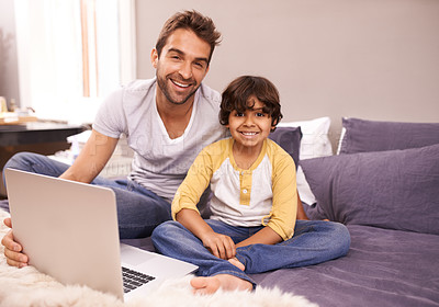 Buy stock photo Portrait, father and child with laptop in bed for connectivity, technology and streaming online for cartoon. Family, man and young boy at home with computer, movie and bonding together in bedroom