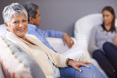 Buy stock photo Portrait of a senior woman sitting with her husband and adult daughter at home