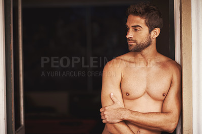 Buy stock photo Cropped shot of a shirtless young man at home