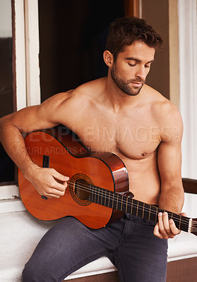 Buy stock photo Guitar, learning or man in home for music, performance or entertainment with sound, rhythm or talent. Playing solo, topless artist or creative musician with an instrument for practice routine alone