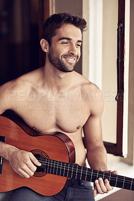 Buy stock photo Man, guitar or home to relax as inspiration, thinking or idea of future, or vision on break with smile. Memory, shirtless or happy artist playing with musical instrument to remember, chill or rest