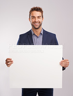 Buy stock photo Businessman, smile and confident with poster in studio on white background for startup company as salesman. Portrait, entrepreneur and happy to advertise for sales and  corporate with mockup