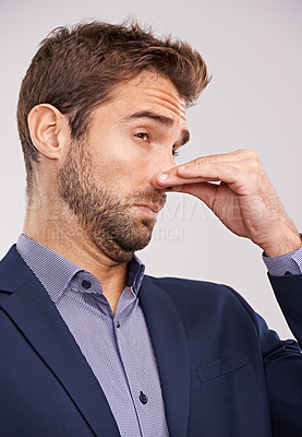 Buy stock photo Entrepreneur, man and studio with smell or hand gesture on white background for stinky place and  corporate. Closeup, businessman and nose closed for fart at with dislike in suit and professional