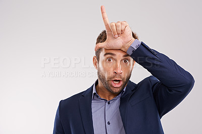 Buy stock photo Portrait, business and man with loser gesture, fail and facial expression on a white studio background. Face, employee and entrepreneur with emoji and L sign with social media or review with feedback