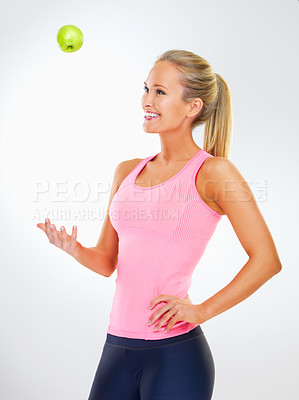 Buy stock photo Woman, apple and wellness in studio for vitamins, nutrition and play with fruit on white background. Female person, happy and organic snack or vegan diet for wellbeing, balance and minerals in fiber