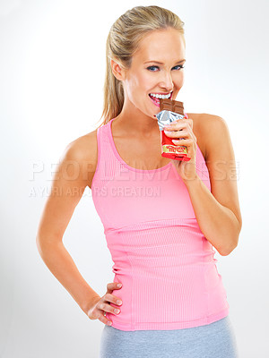 Buy stock photo Portrait, chocolate bar or woman with fitness, smile or unhealthy snack on white studio background. Face, person or model with cocoa product or eating a cheat day treat with diet plan, sugar or candy