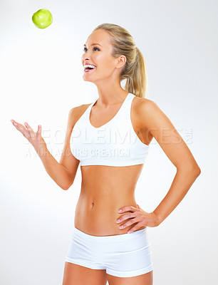 Buy stock photo Woman, apple and smile in studio for health, nutrition and play with fruit on white background. Female person, underwear and organic snack or vegan diet for wellbeing, vitamins and minerals in fiber