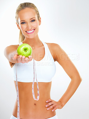 Buy stock photo Happy, tape measure and portrait of woman with apple for detox, healthy diet or weight loss progress. Studio, fruit and person with smile for nutrition, body care and wellness on white background