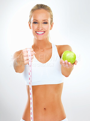 Buy stock photo Fitness, woman and portrait with apple and measuring tape for exercise, health and wellness for diet in studio. Model, dietician or nutritionist with fruit for cleanse, strength and vitamin for detox