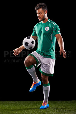 Buy stock photo Man, ball and soccer for sport, balance and fitness for game, active and sportswear on grass or field. Professional,  athlete or player and practice for competitive and score on dark background