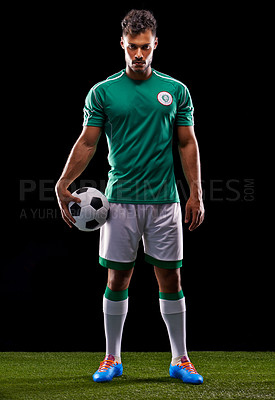 Buy stock photo Full length studio shot of a handsome young soccer player isolated on black