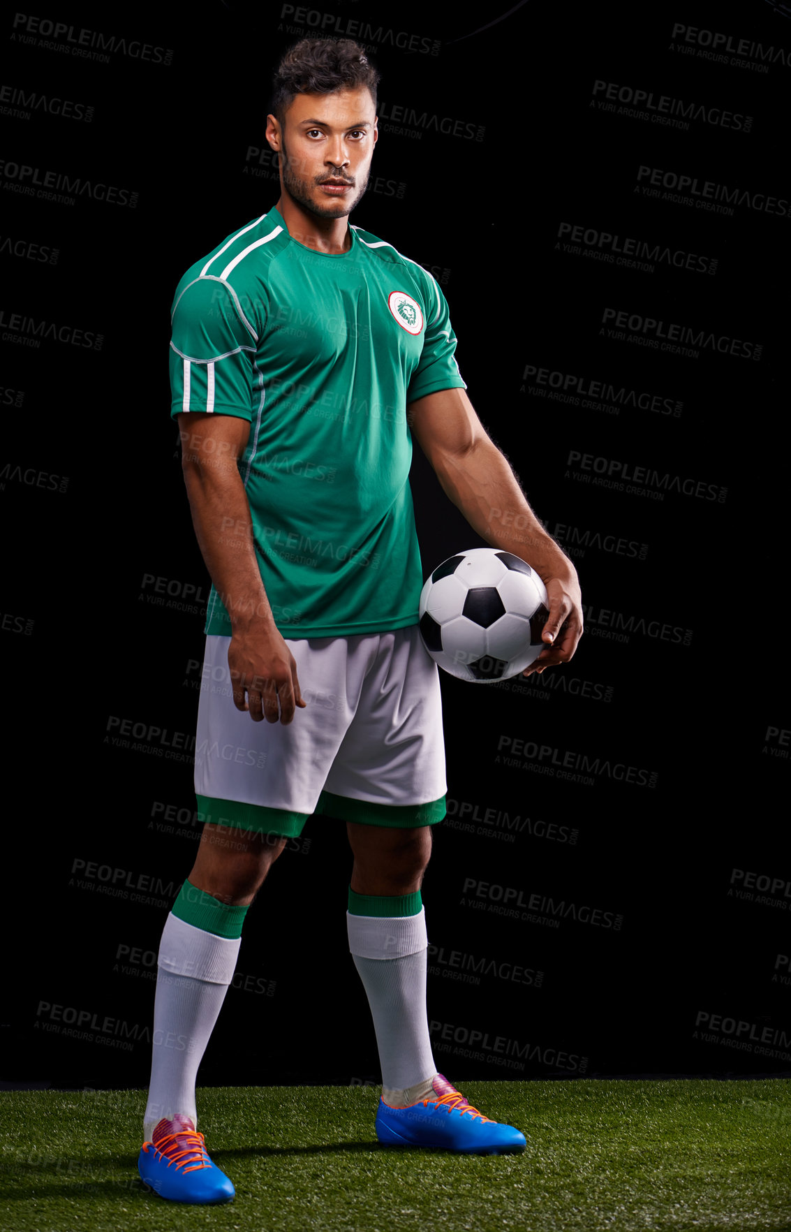 Buy stock photo Man, ball and portrait for soccer, sport and match for fitness  game and active for sportswear on grass or field. Role model or athlete and practice with kit for competitive on dark background