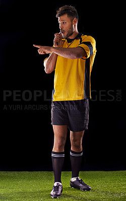 Buy stock photo Shot of a referee against a black background