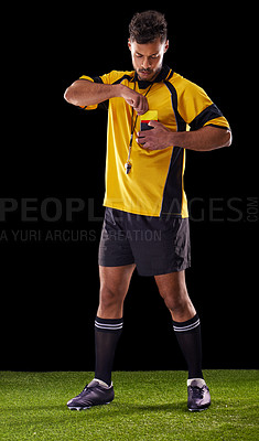 Buy stock photo Shot of a referee against a black background