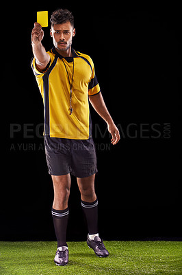Buy stock photo Portrait, referee or man with a yellow card for warning, foul call or penalty review in sports game on turf. Soccer match, discipline or person with punishment, rules or caution on black background