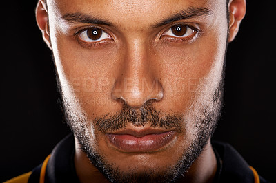 Buy stock photo Portrait, serious and closeup of man in studio isolated on a black background. Face, confidence and skin of a young handsome male person with beard for profile picture on a backdrop in Argentina