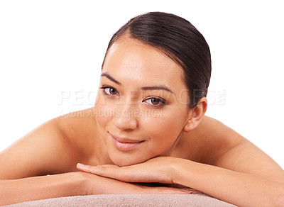 Buy stock photo Health, portrait and woman at spa for massage with skincare, wellness or body treatment in studio. Happy, smile and face of Asian female person on table for relaxing routine by white background.