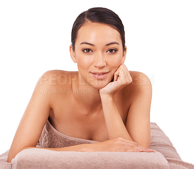 Buy stock photo Happy, portrait and woman at spa for massage with skincare, wellness or body treatment in studio. Smile, health and face of Asian female person on table for relaxing routine by white background.