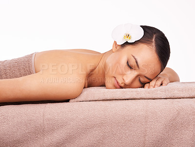 Buy stock photo Spa, natural and woman resting in studio for massage, relax or luxury treatment for stress relief. Wellness, skincare and female person with flower for zen, self care and detox on white background