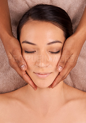 Buy stock photo Facial massage, relax and woman for wellness spa, detox and resting in luxury resort. Skincare, top view and face of calm female person for self care, exfoliate and beauty treatment in salon