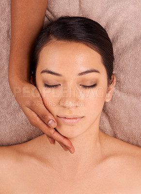 Buy stock photo Massage facial, hand and relax woman for beauty treatment, detox and resting in luxury resort. Skincare, top view and face of calm female person for self care, exfoliate and wellness spa in salon