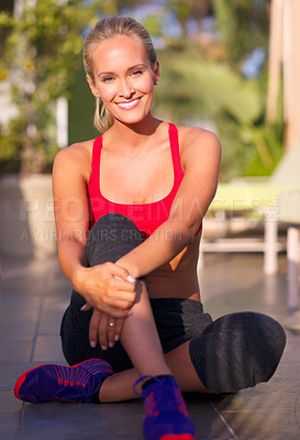 Buy stock photo Portrait of an attractive woman in sports wear sitting outside