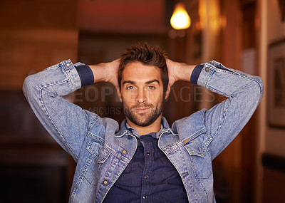 Buy stock photo Portrait, smile and handsome male person in home, fashion and denim for relax or holiday. Confidence, smirk and style for man model with hands behind head, trendy and on vacation in Texas house