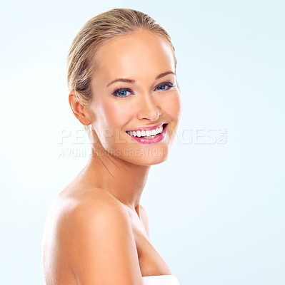 Buy stock photo Studio, skincare and portrait of woman with beauty for cosmetics treatment, dermatology or self care. Female person, confidence and happy with facial glow, healthy skin or wellness on blue background