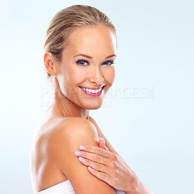 Buy stock photo Portrait, woman and skincare in studio with cosmetic treatment, dermatology or facial glow. Female person, happy and smile with confidence for self care, skin health or wellness on blue background