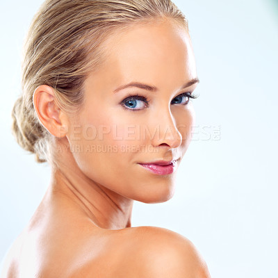 Buy stock photo Studio, confidence and portrait of woman with skincare for beauty treatment, dermatology or wellness. Female person, smile and pose with healthy skin, self care or facial glow on blue background